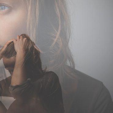 Depressed, anxious young woman facing harsh life situation, suffering from mental disorders, illness