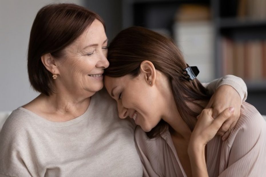 Close,Up,Smiling,Young,Woman,And,Mature,Mother,Hugging,,Elderly